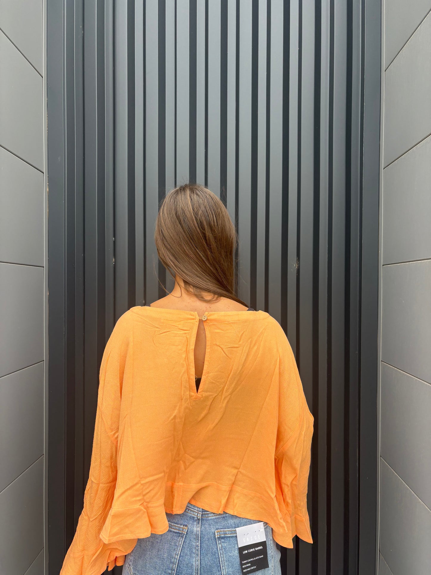 sorbet orange flowy ruffled top