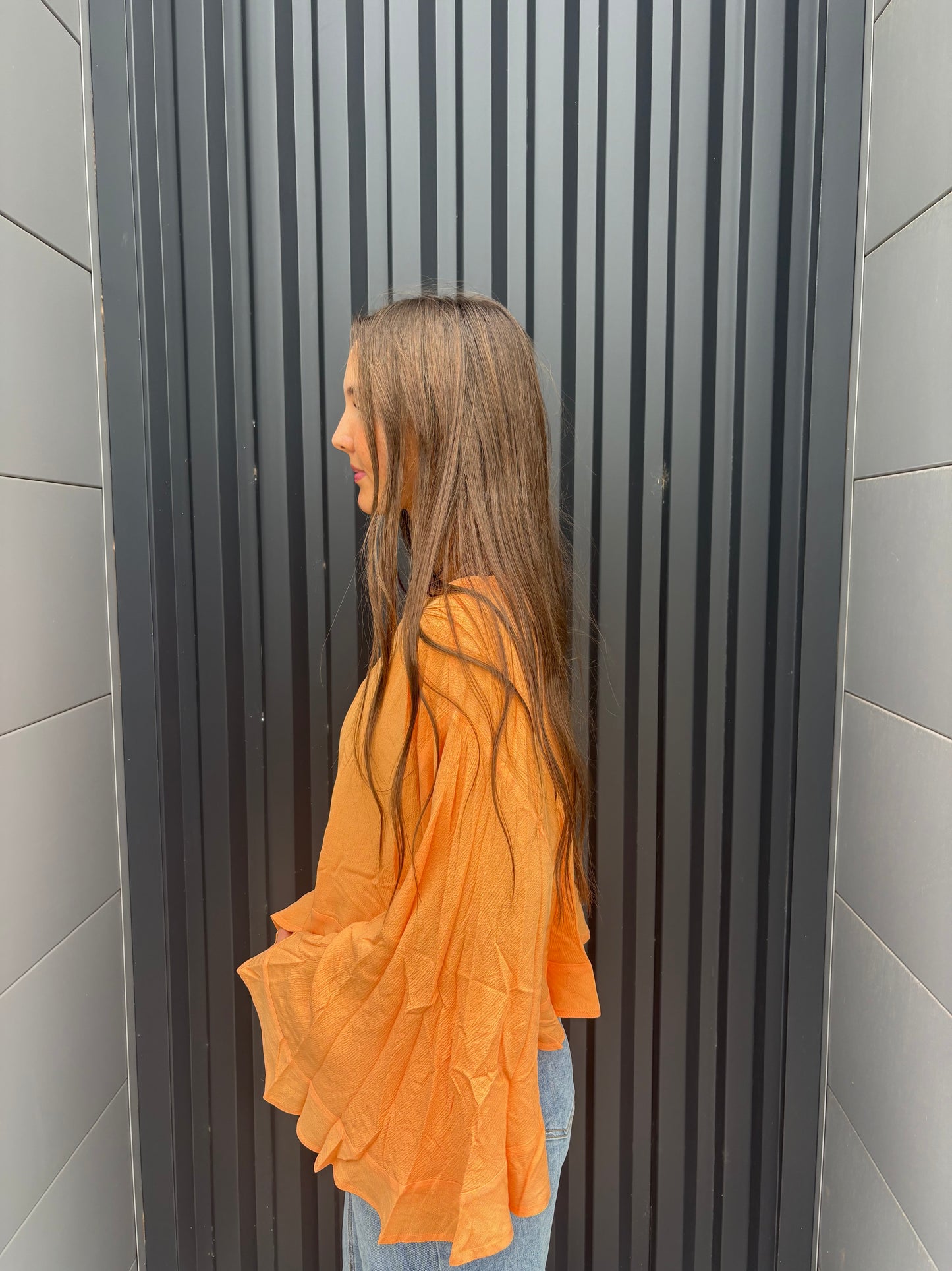sorbet orange flowy ruffled top