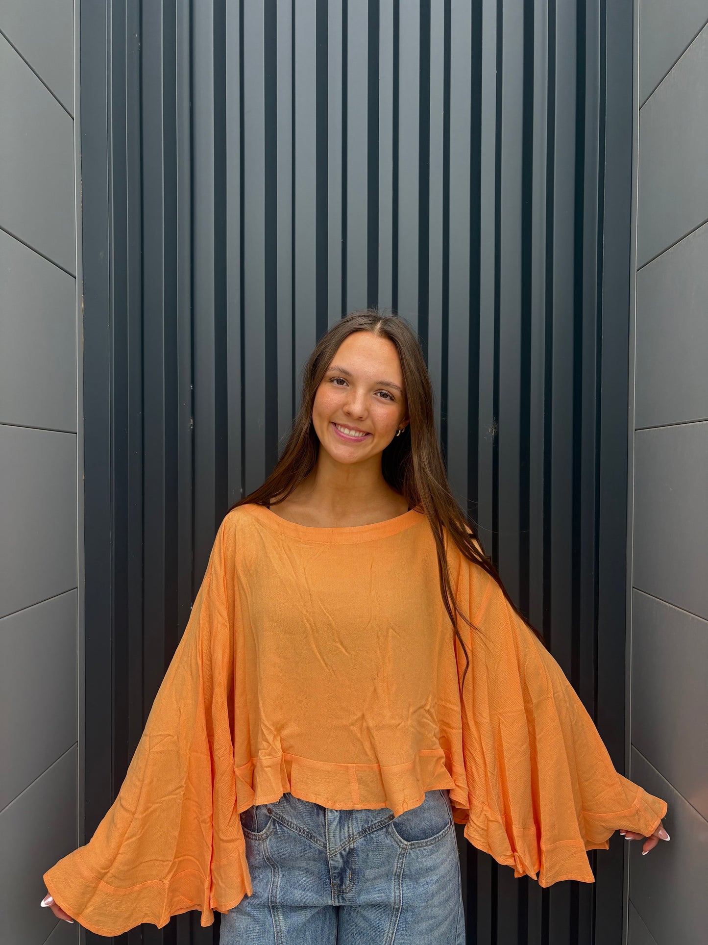 sorbet orange flowy ruffled top