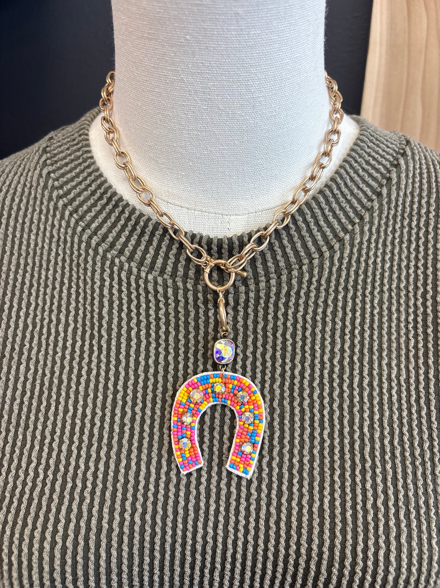 Gold and rainbow beaded horse shoe necklace
