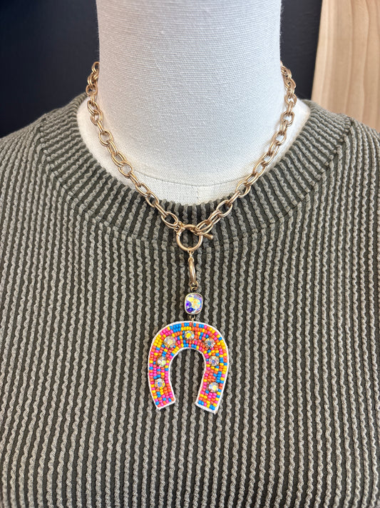 Gold and rainbow beaded horse shoe necklace