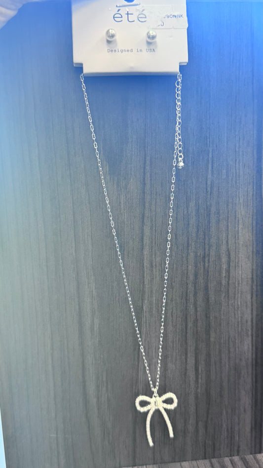 silver and pearl bow necklace with pearl earings